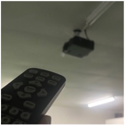 Projector remote pointed at ceiling projector